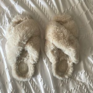 Fuzzy white slippers